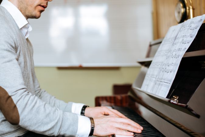 Man playing piano in studio