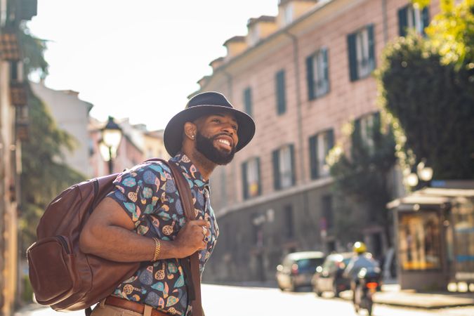 Stylish Black man walking on the city street