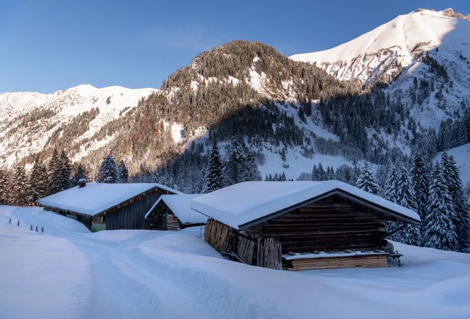 Rustic mountain cabins in deep snow in the Bavarian Alps, Germany