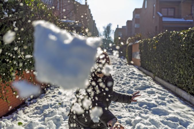 Person throwing snowball