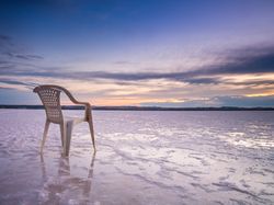Chair on salt mine during sunset