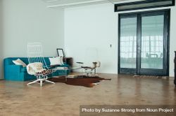 Bright open loft room with minimal furniture 0JP7w4