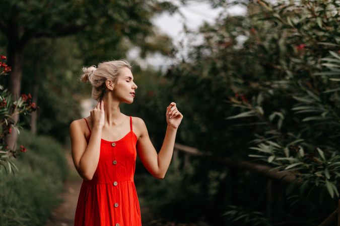 Dreamy young woman in summer garden