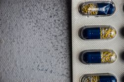 Top view of pills on grey counter