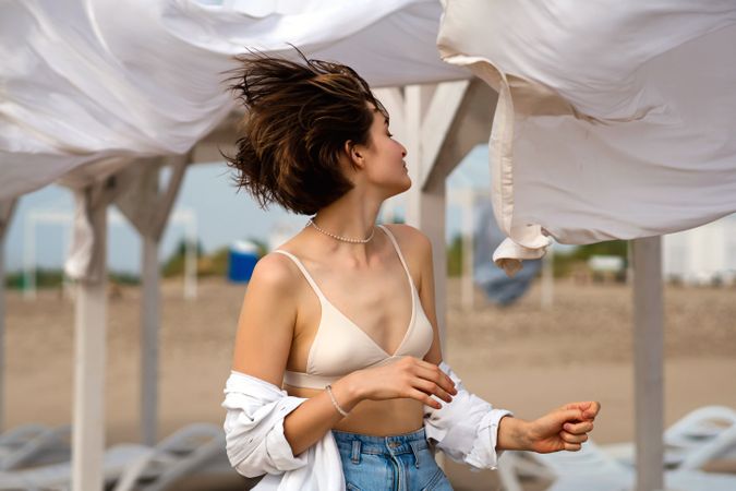 Woman on beach on windy day