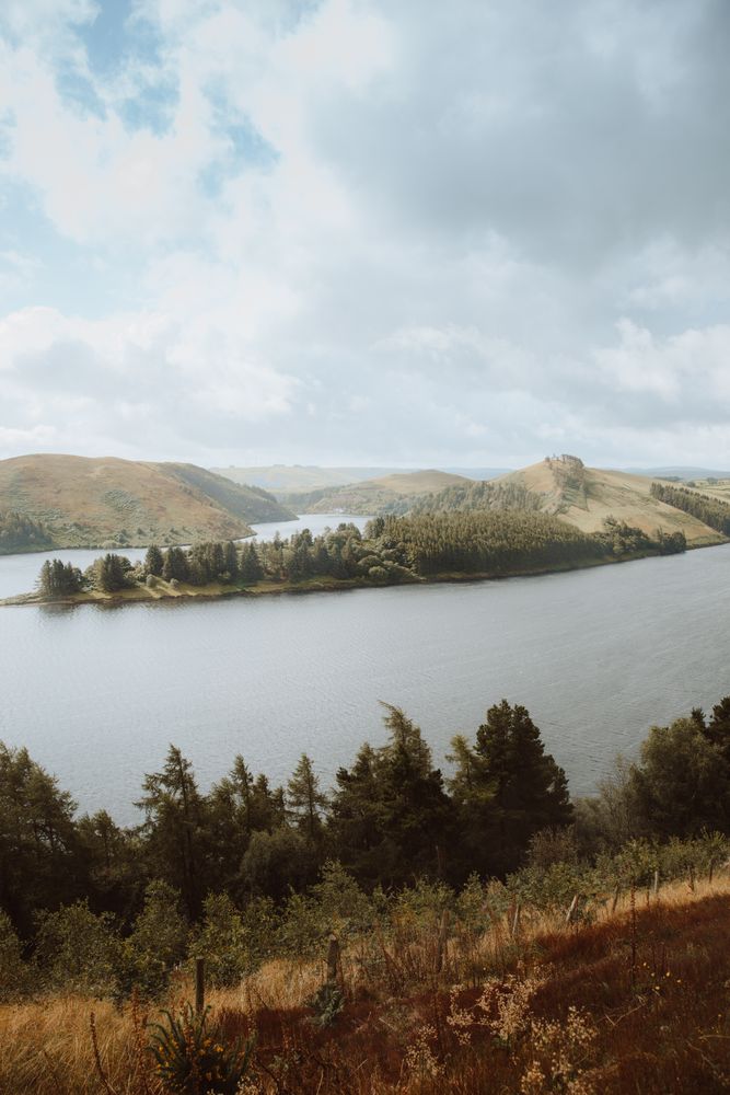 Majestic view of lake surrounded by hills