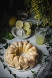 Bundt cake cut into pieces on table