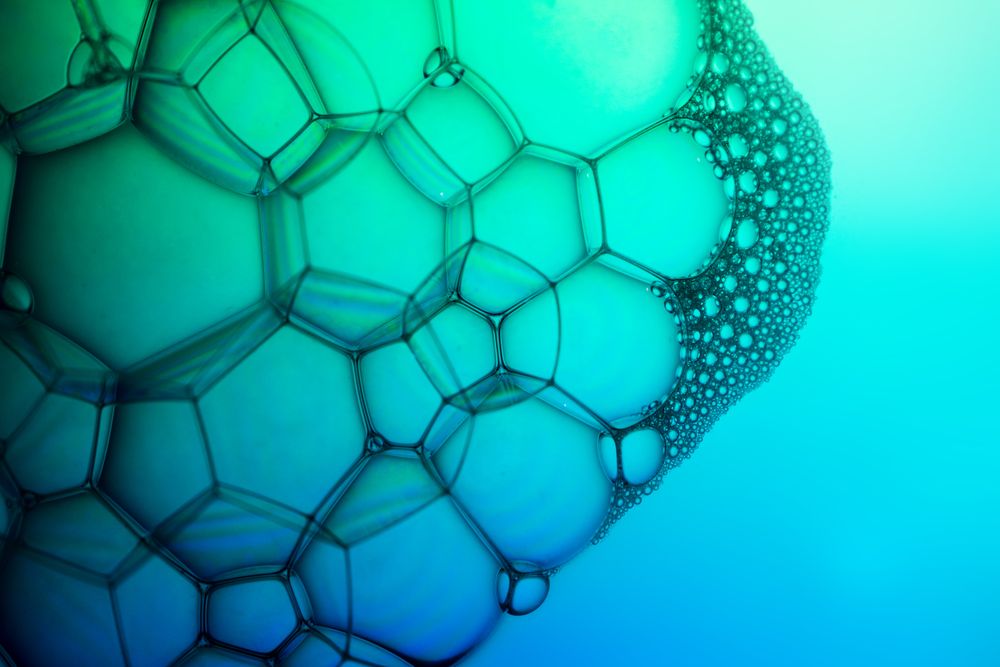 Abstract background bio technology, macro photography foam and water with gradient background. Molecule multicolor backgorund