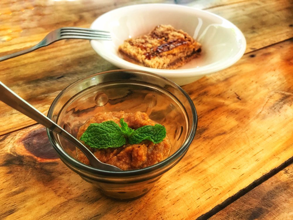 Slice of dessert and side sauce