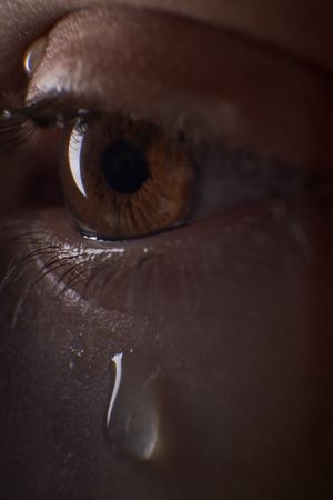 Faceless discontent kid with tears