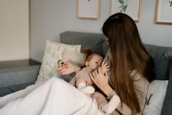 Mother breastfeeding her baby girl