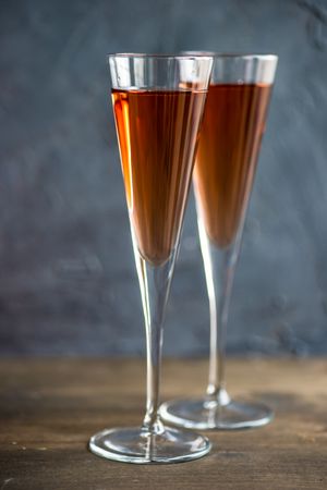 Two pink champagne flutes in glasses