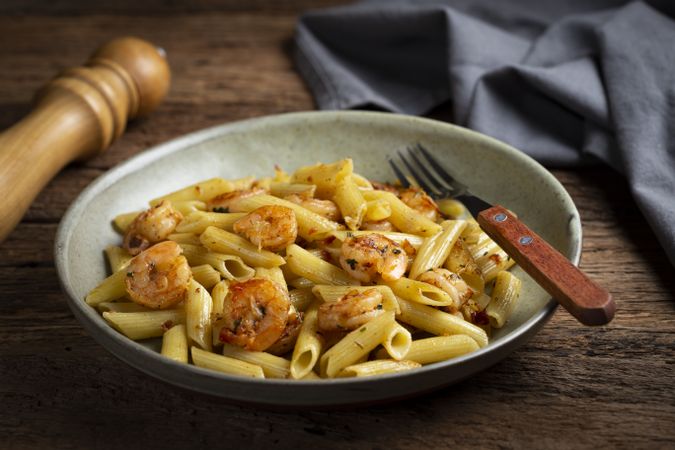Penne pasta with grilled shrimp.