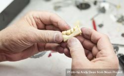 Dental Technician Working On 3D Printed Mold For Tooth Implants 5oDkBy