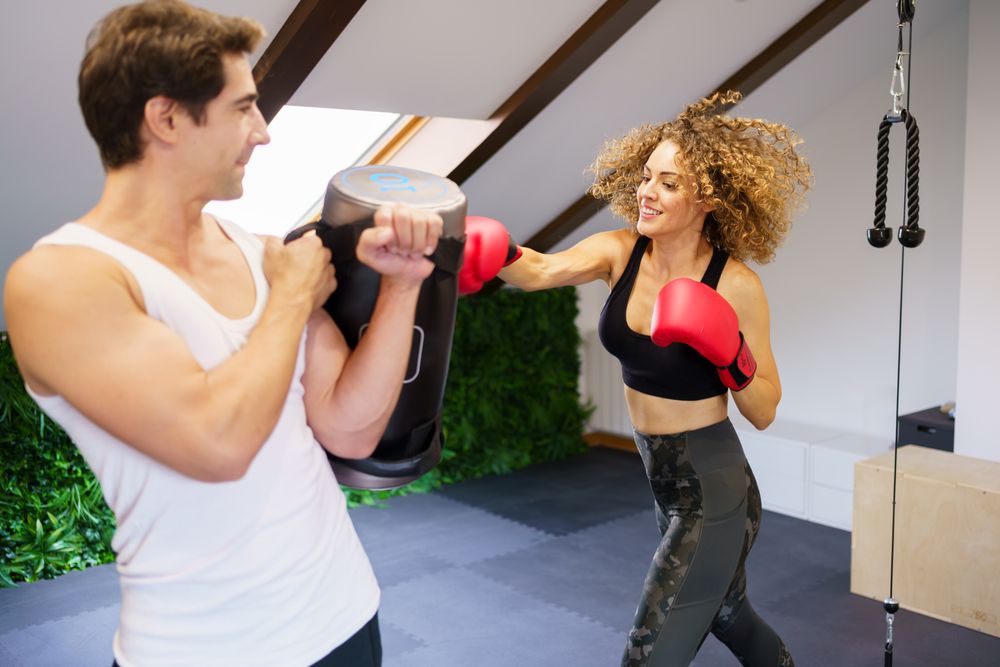 Couple exercising in boxing gloves