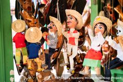 Puppets hanging at market stand for sale bY6N90