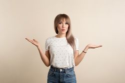 woman posing in pastel background
