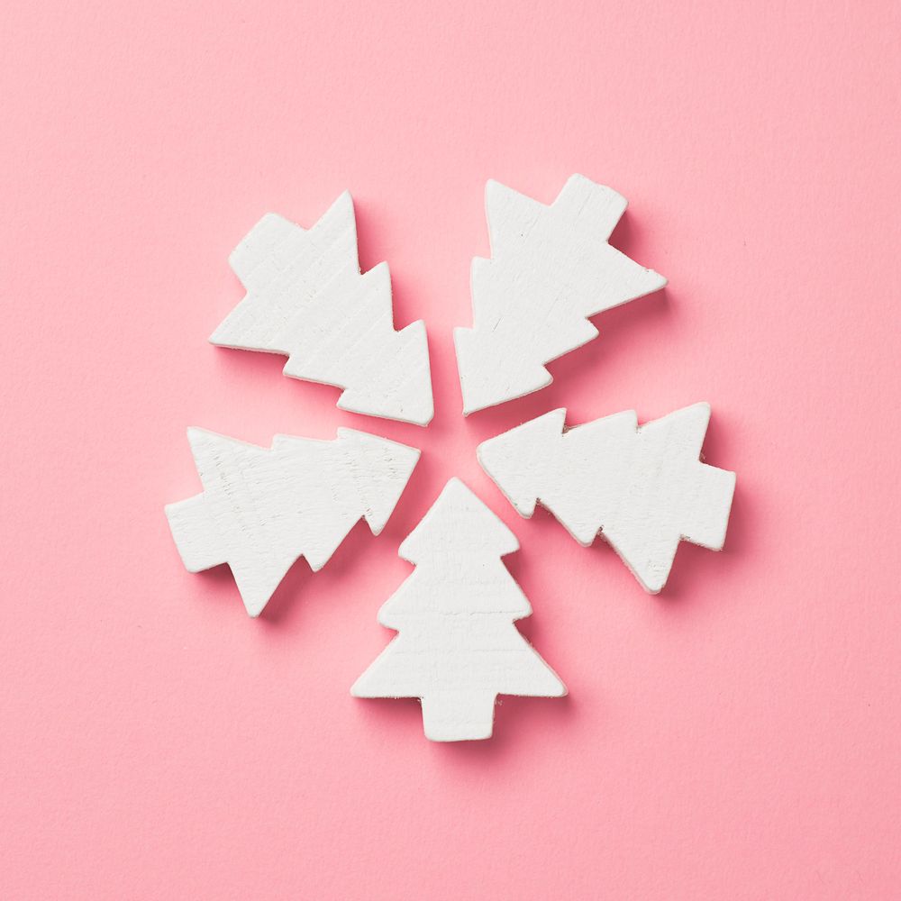 Light pine trees on pink background