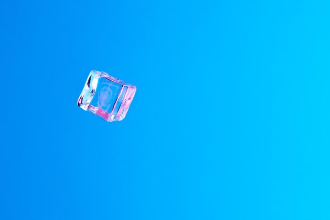 Ice cube in vibrant bold gradient purple and blue holographic color lights