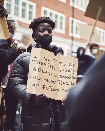 London, England, United Kingdom - June 6th, 2020: Boy holding sign at BLM protest