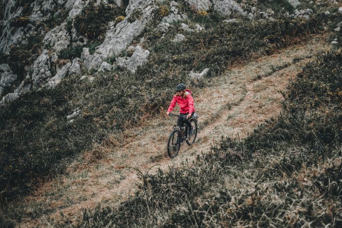Female riding bicycle on countryside