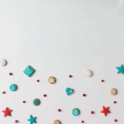 Colorful pattern made of Christmas cookies and red berries