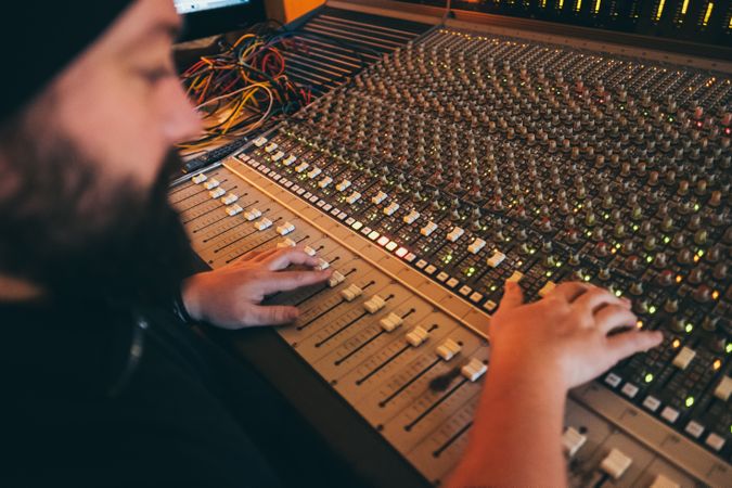 Man in a equalizer instrument in a studio