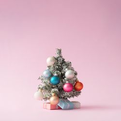 Colorful Christmas tree on pastel pink