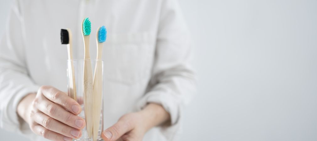 Bamboo toothbrushes in glass