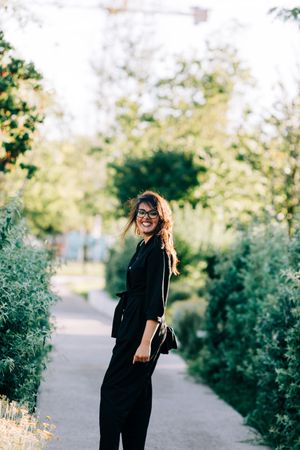 Cheerful female walking in park