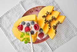 Dessert made of papaya berries and yogurt