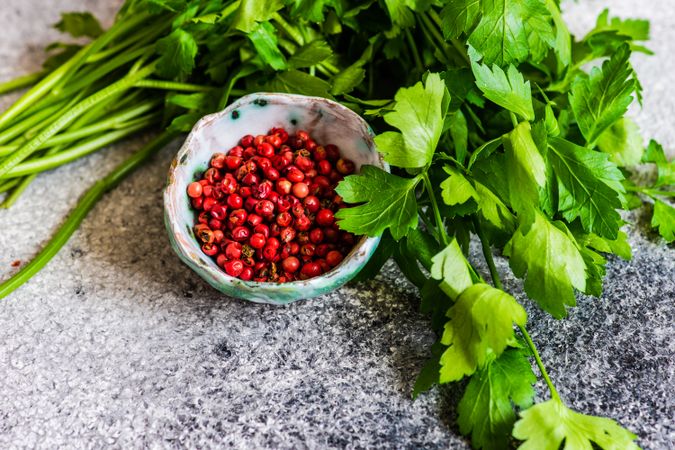 Bowl of peppercorns with parsley