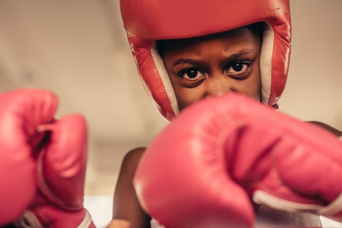 Girl in boxing gear during a boxing fight