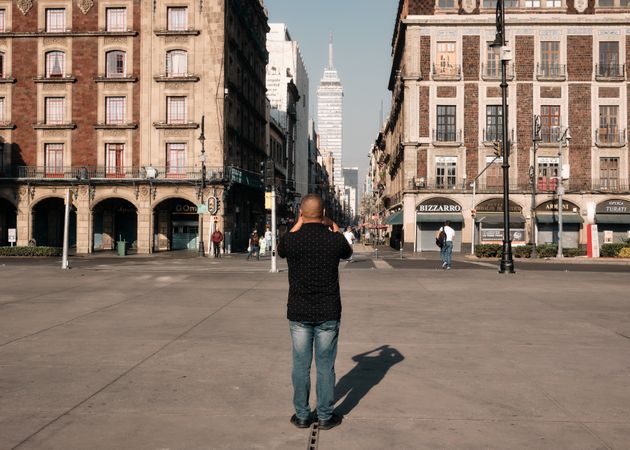 Back of man taking photo in Mexico City