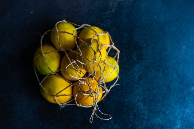 Whole lemons in string bag