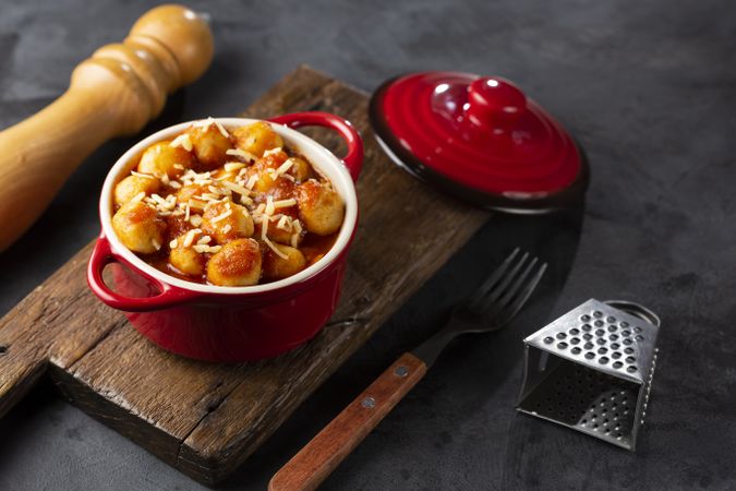 Gnocchi with tomato sauce and grated Parmesan cheese.