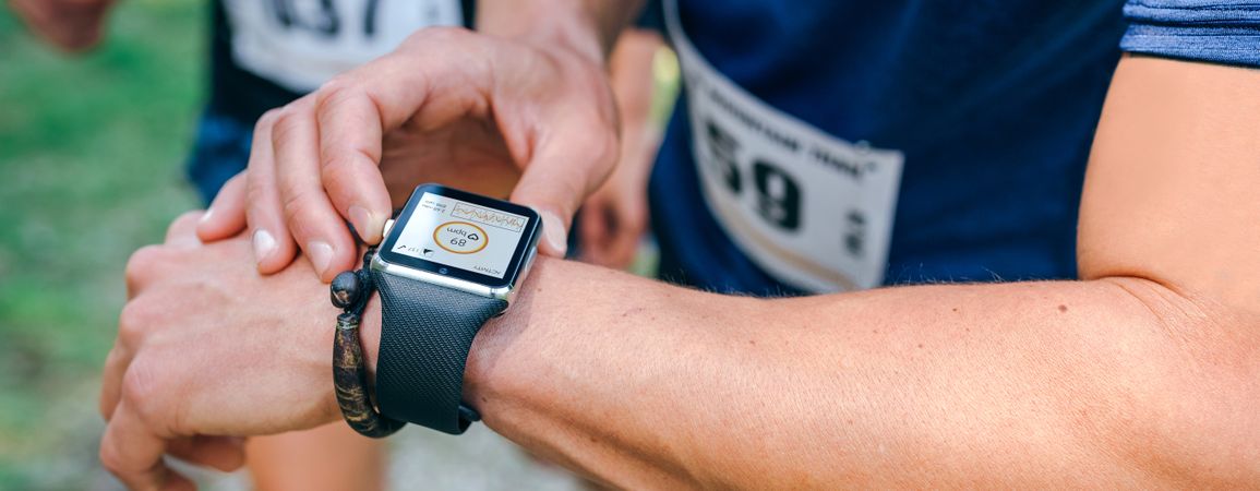 Sportsman looking a smartwatch