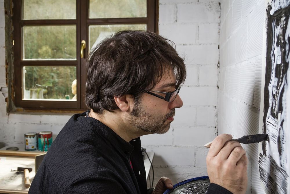 Painter artist working on a oil canvas