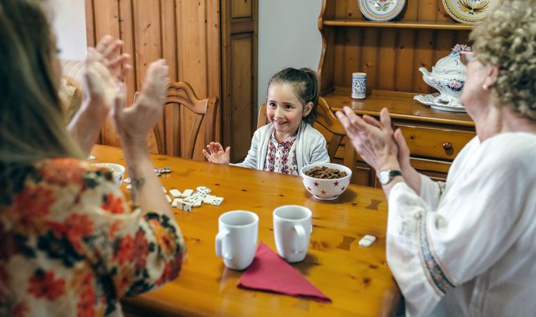 Little girl winning domino