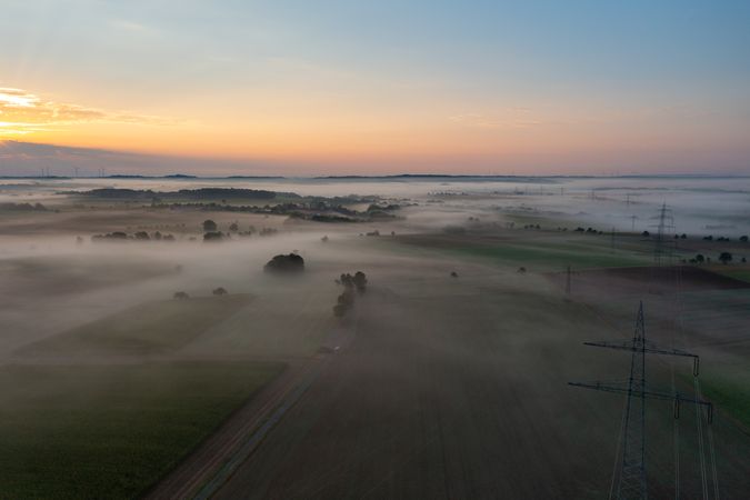 Sunrise aerial view in a german village on a foggy morning