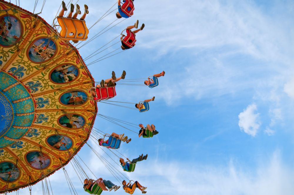 Low angle view of people riding carousel