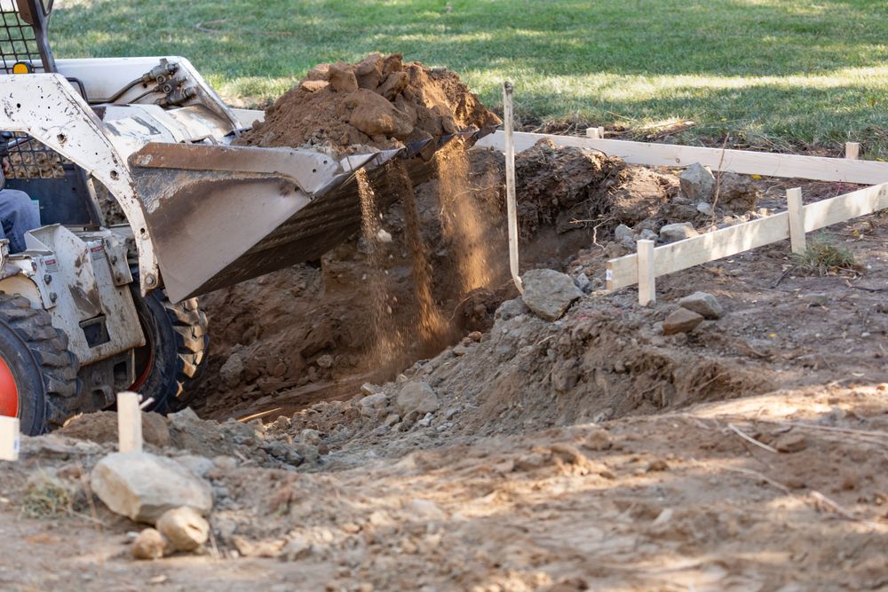 Small Bulldozer Digging In Yard For Pool Installation