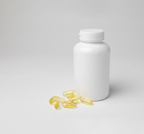 Mockup of a bottle of omega 3 capsules, food supplement, with copyspace