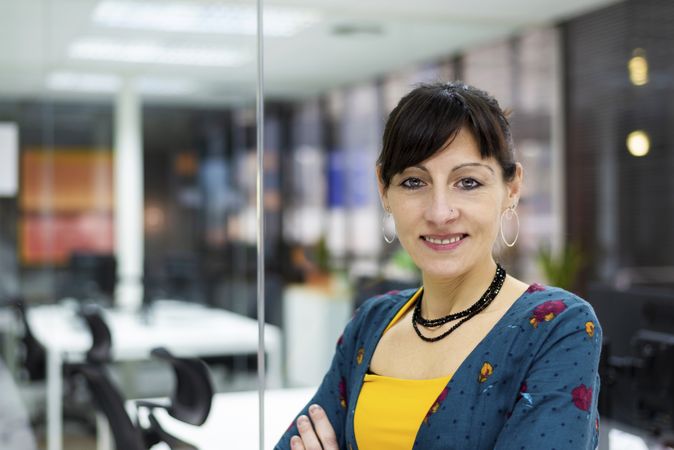 Confident businesswoman standing in office