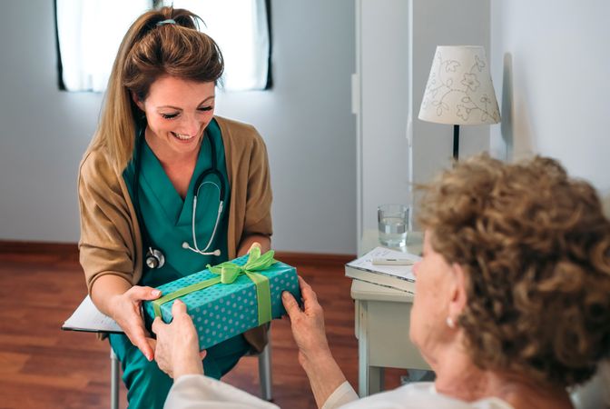 Patient giving a gift to her doctor