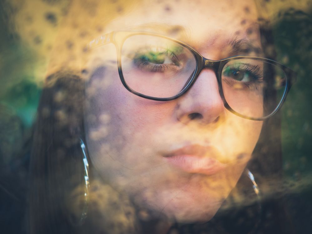 Woman in eyeglasses and earrings