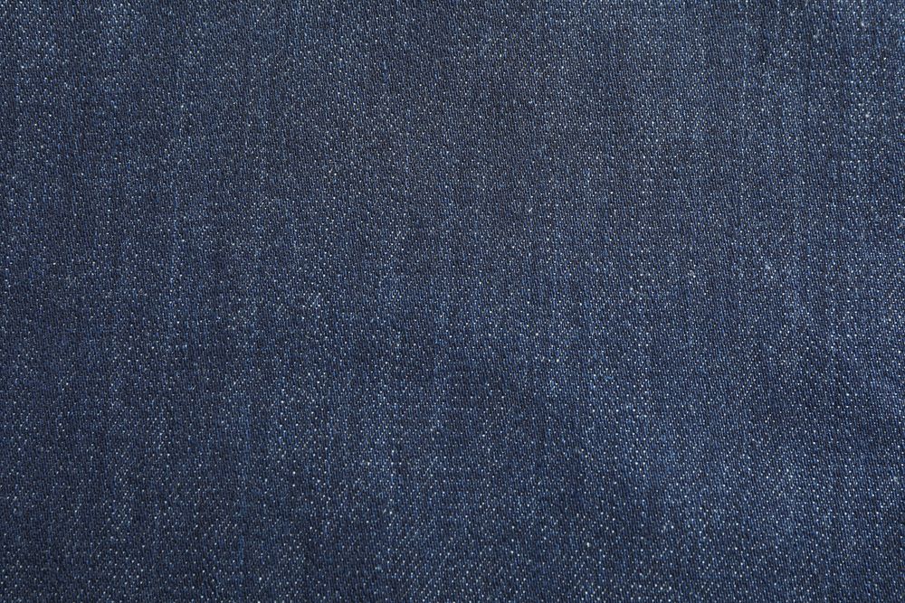 Texture of blue jeans as background, space for text