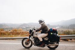 Side view of motorcyclist in full gear