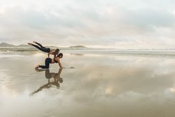 Women exercising near sea