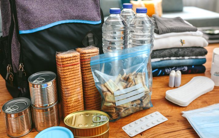 Emergency backpack equipment organized on the table